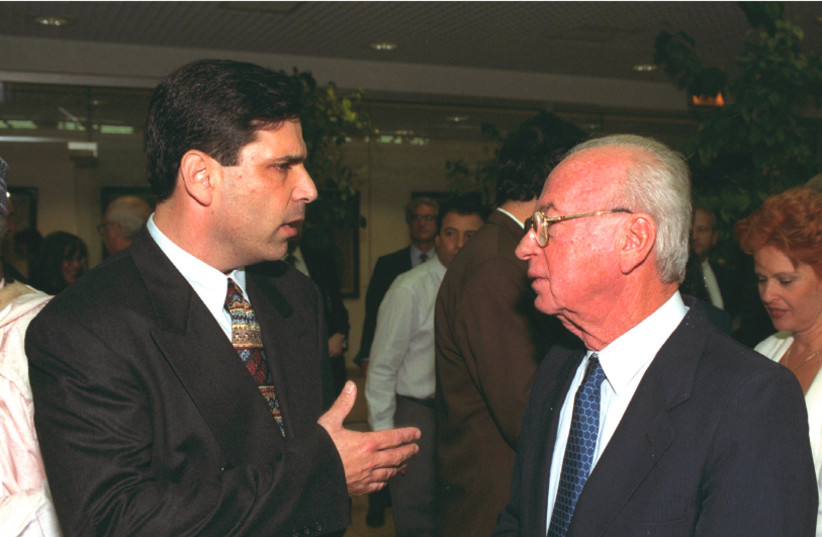 Then-energy minister Gonen Segev talks to prime minister Yitzhak Rabin at the opening of the Jerusalem Economic Conference in 1995 (photo credit: YAACOV SAAR/GPO)