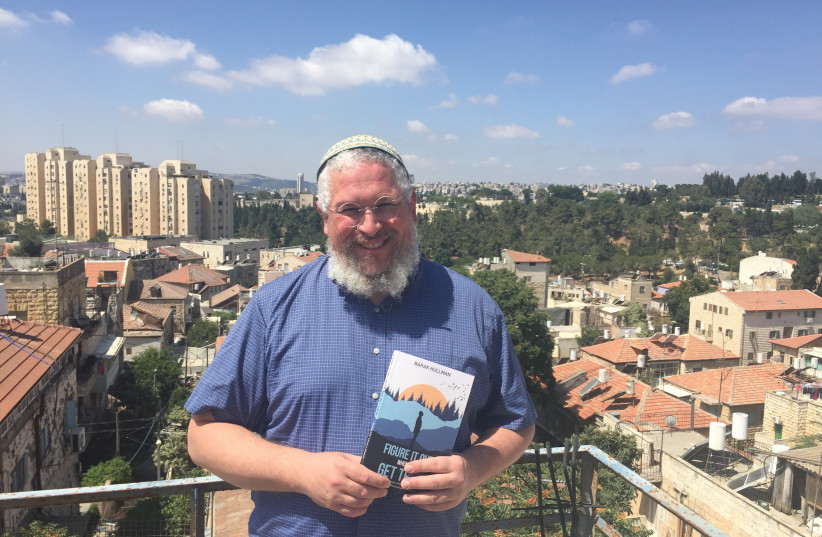 Taking things slowly in Jerusalem: Barak Hullman, holding a copy of his new memoir (photo credit: ARIEL DOMINIQUE HENDELMAN)