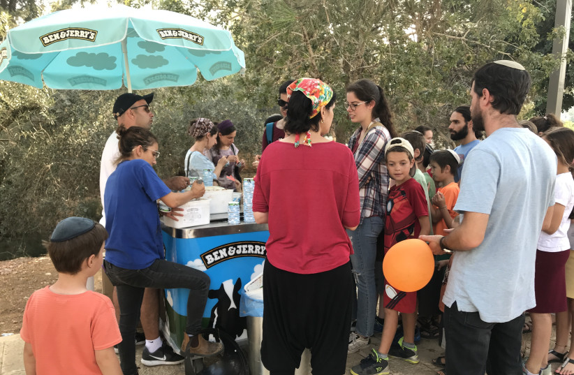 Around 400 people waited in line at Gan HaMifletset (Rabinovich Garden) Thursday evening, where Ben & Jerry's gave out free ice cream to celebrate 40 years in Israel (photo credit: ELIANA SCHREIBER)