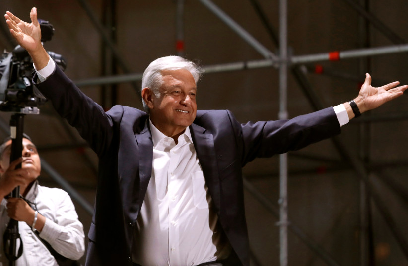 Mexico's next President Andres Manuel Lopez Obrador gestures to supporters, in Mexico City, Mexico July 1, 2018. Picture taken July 1, 2018.  (photo credit: ALEXANDRE MENEGHINI/ REUTERS)
