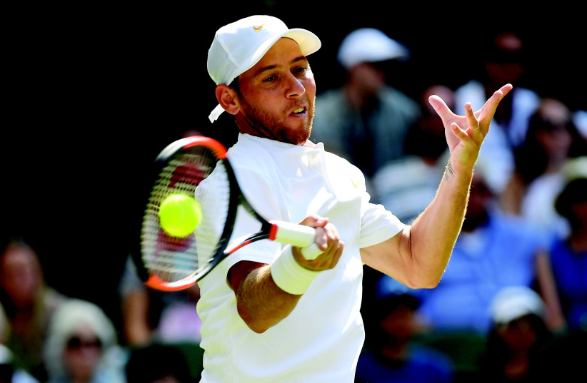 ISRAEL’S DUDI SELA in action during yesterday’s first-round match against Spain's Rafael Nadal at Wimbledon, which Nadal won in straight sets. (photo credit: REUTERS)