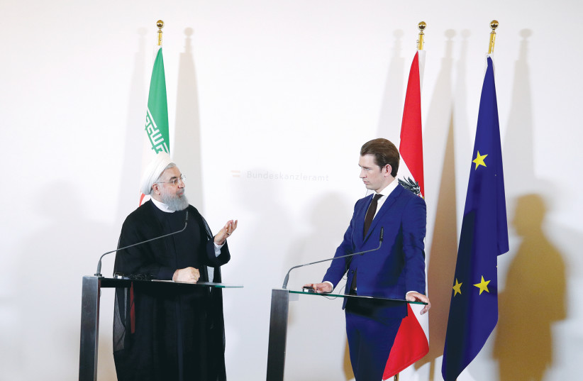 IRAN PRESIDENT Hassan Rouhani and Austrian Chancellor Sebastian Kurz attend a news conference at the Chancellery in Vienna.  (photo credit: REUTERS/LISI NIESNER)