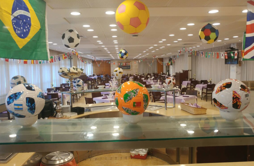 Soccer balls and world flags hung up around the Knesset cafeteria, July 8, 2018 (photo credit: KNESSET)
