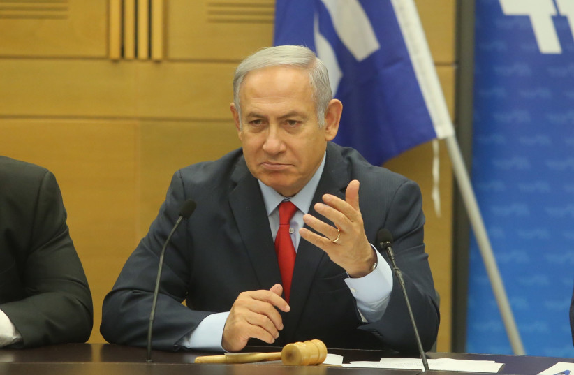 Benjamin Netanyahu gestures with his hand during a cabinet meeting (photo credit: MARC ISRAEL SELLEM/THE JERUSALEM POST)