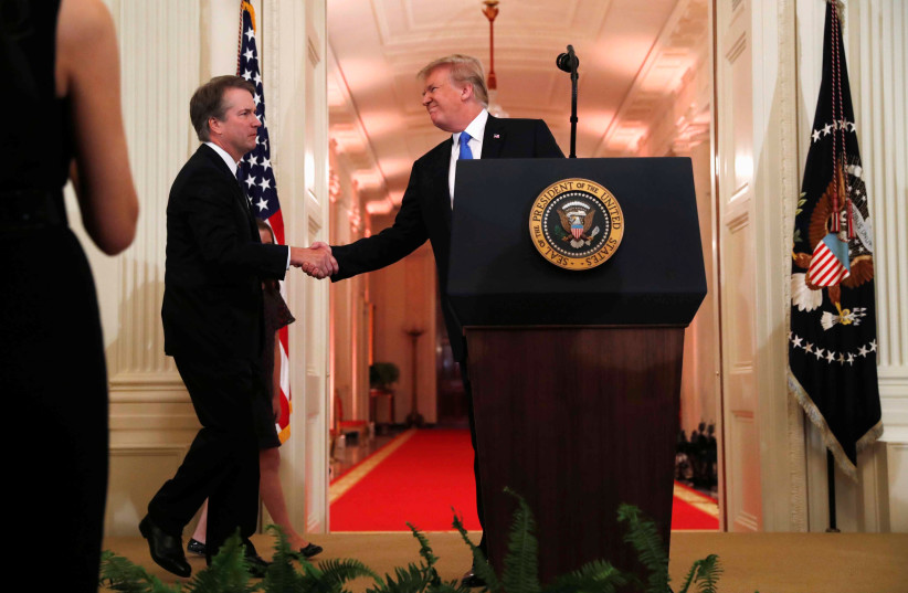 US President Donald Trump introduces his Supreme Court nominee judge Brett Kavanaugh in the East Room of the White House in Washington, US, July 9, 2018 (photo credit: REUTERS/LEAH MILLIS)