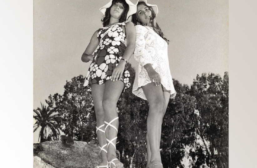 YOUNG WOMEN show off their fancy footwear in the 1960s (photo credit: YAKI HALPERIN)