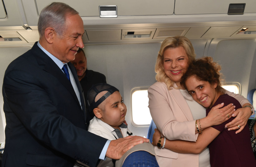 Sara and Benjamin Netanyahu invite two children who are sick with cancer to watch the World Cup soccer game in Moscow (photo credit: PRIME MINISTER'S OFFICE)