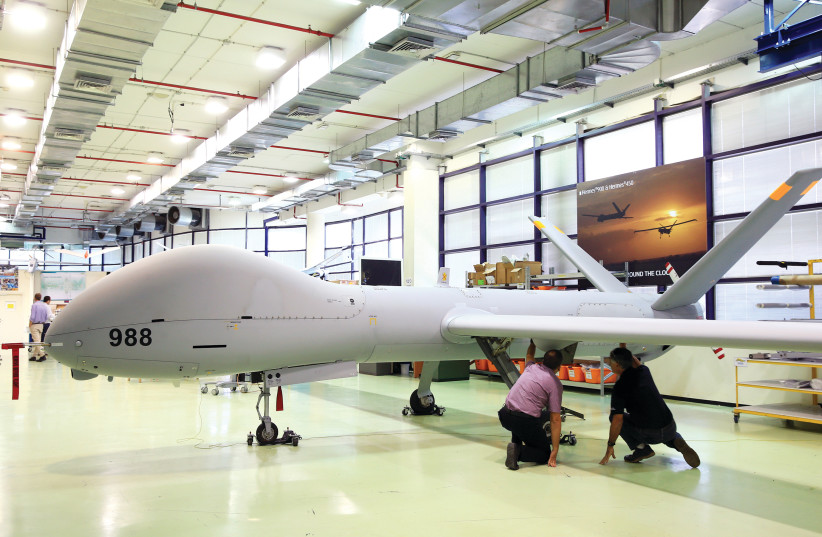 EMPLOYEES CHECK an Elbit Systems Ltd. Hermes 900 unmanned aerial vehicle (UAV) at the company’s drone factory in Rehovot last month. (photo credit: REUTERS/OREL COHEN)