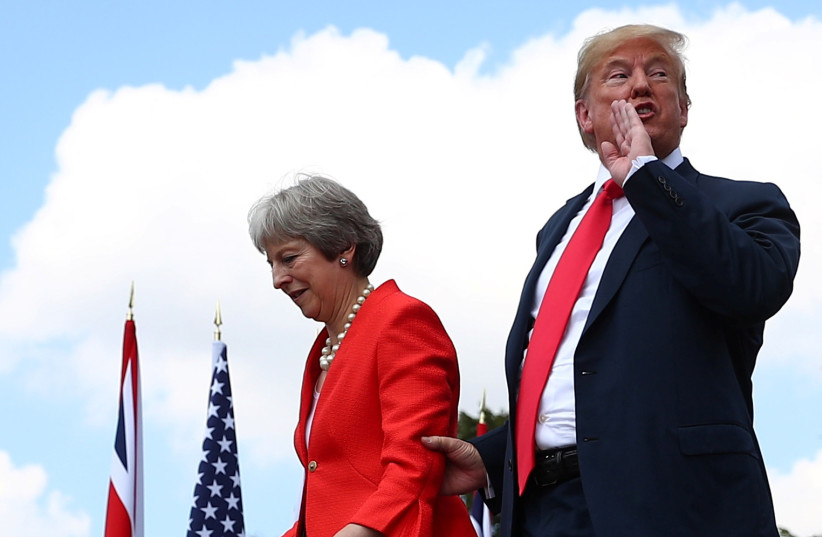 Britain's Prime Minister Theresa May and US President Donald Trump walk away after holding a joint news conference at Chequers, the official country residence of the Prime Minister, near Aylesbury, Britain, July 13, 2018 (photo credit: HANNAH MCKAY/ REUTERS)