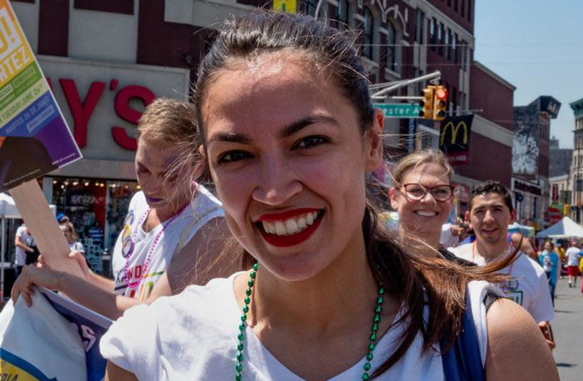 Alexandria Ocasio-Cortez marches during the Bronx's pride parade in the Bronx borough of New York City, New York, U.S., June 17, 2018 (photo credit: REUTERS)