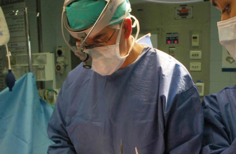 PROF. AVIRAM NISSAN performing lifesaving surgery at Sheba Medical Center (photo credit: Courtesy)
