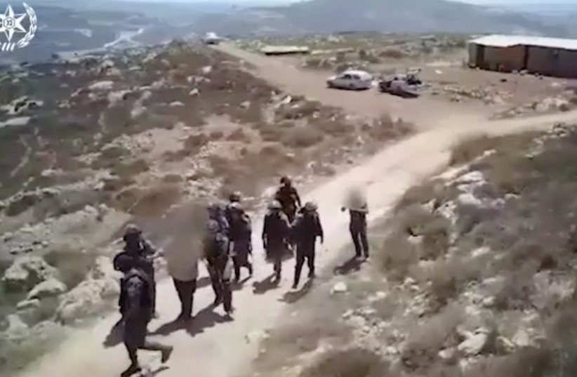 Screenshot from police footage of clashes with settlers in Yitzhar, July 19, 2018 (photo credit: ISRAEL POLICE)