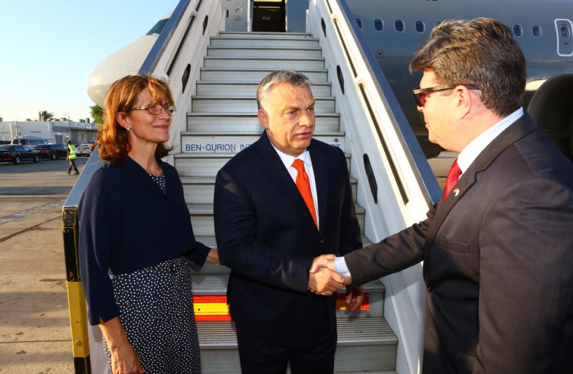 Hungarian Prime Minister Viktor Orban is greeted on arrival at Ben-Gurion Airport, July 18, 2018 (photo credit: FOREIGN MINISTRY)