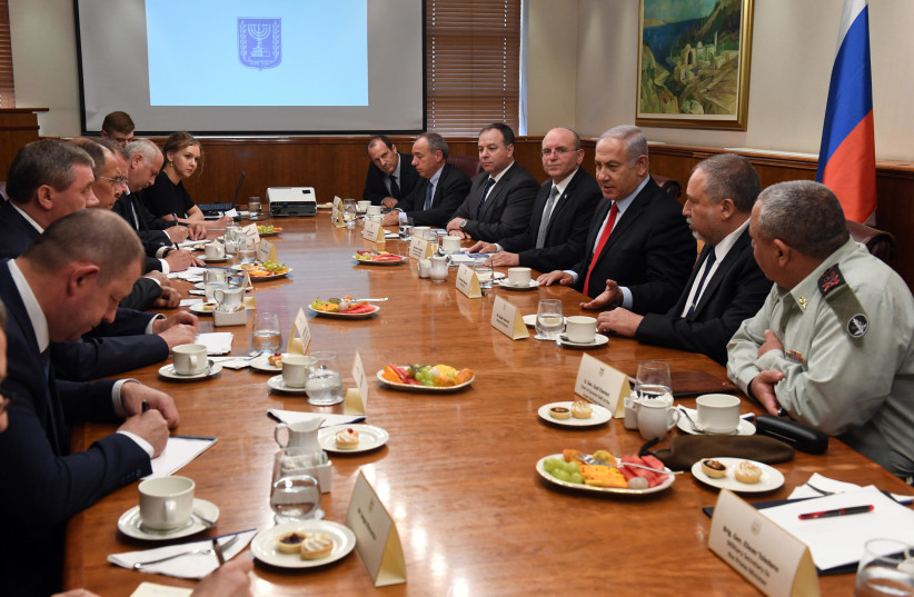 Prime Minister Benjamin Netanyahu (C-R), Defense Minister Avigdor Liberman and IDF Chief of Staff Gadi Eizenkot discuss regional developments with Russian officials, July 23, 2018 (photo credit: HAIM ZACH/GPO)