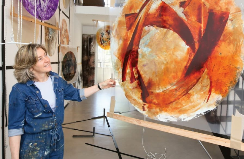BEVERLY BARKAT looks at one of the paintings that will make up part of her new exhibition ‘After the Tribes.’ (photo credit: MARC ISRAEL SELLEM)
