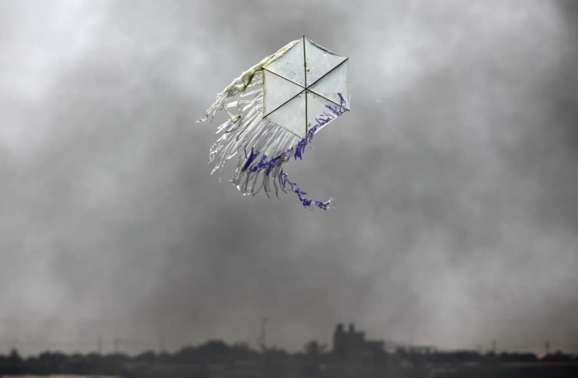 A KITE flies over the Gaza border into an area where incendiary kites and balloons have caused major fires in southern Israel. (photo credit: AMIR COHEN/REUTERS)