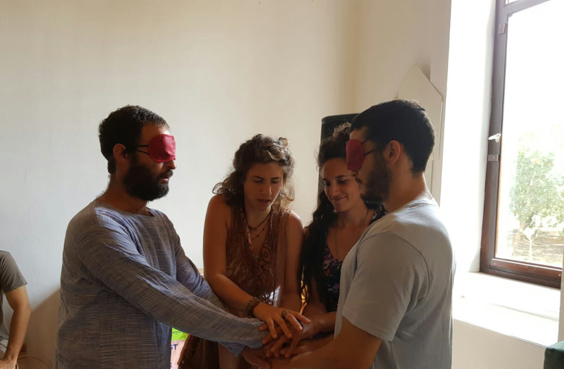  an exercise that has to do with the development of trust and the creation of a safe container that can hold the deep feelings that come up later on in the workshop. (photo credit: NITSAN GORDON)
