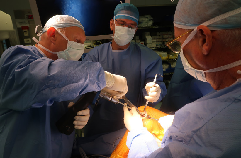 octors at Hadassah Hospital perform the surgery to insert Agili-C into a patient's heal (photo credit: Courtesy)