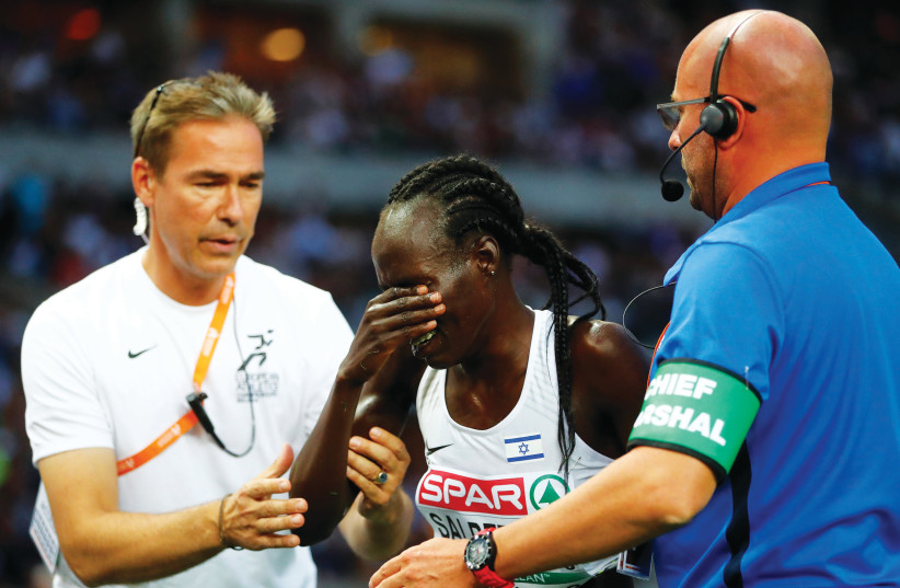 ISRAELI RUNNER Lonah Chemtai Salpeter (center) breaks down in tears after a mental error in the penultimate lap of last night’s 5,000 meters event at the European Championships cost her a medal. (photo credit: REUTERS)