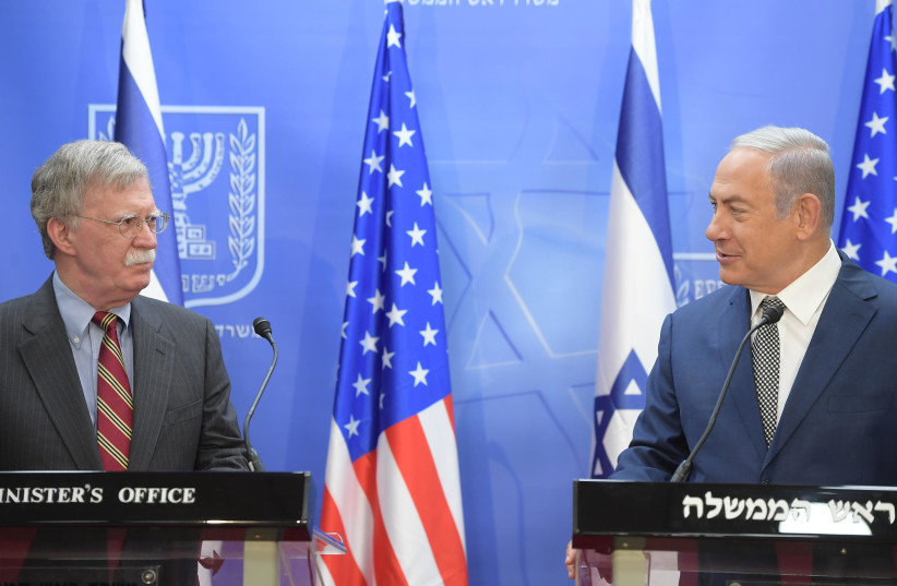 Benjamin Netanyahu and John Bolton speak in Jerusalem, August 20, 2018 (photo credit: AMOS BEN-GERSHOM/GPO)