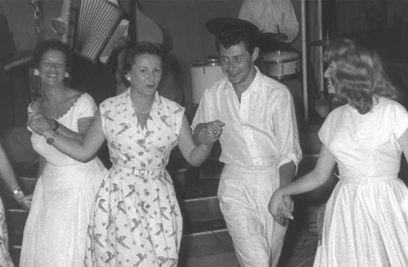 American singer and actor Eddie Fisher dances the hora at Shavei Zion’s Dophin House in 1957 (photo credit: MOSHE PRIDAN/ISRAEL NATIONAL PHOTO COLLECTION)