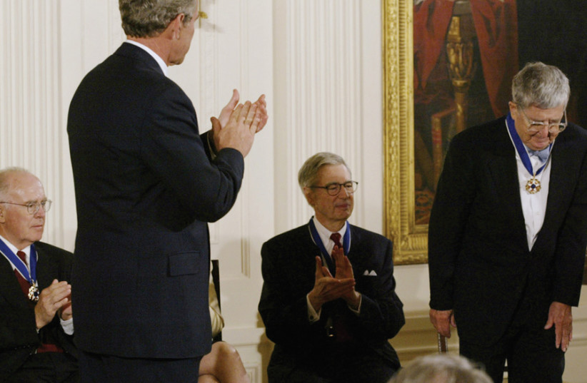 Erez Kaplan Haelion, CTO of Cyber 2.0US President George W. Bush applauds A.M. Rosenthal (right), executive editor of The New York Times, after he was presented with the Presidential Medal of Freedom at the White House on July 9, 2002 (photo credit: REUTERS)