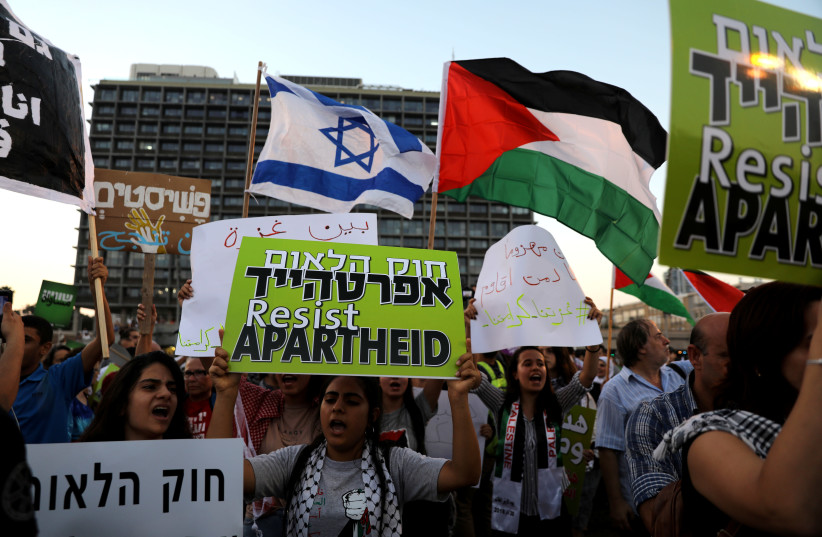 Israeli Arabs and their supporters take part in a rally to protest against Jewish nation-state law in Rabin Square in Tel Aviv, Israel August 11, 2018 (photo credit: REUTERS/AMMAR AWAD)