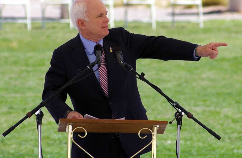 Sen. John McCain speaks at Albuquerque New Mexico during a Memorial day event held in 2008. He is wearing a purple heart. (photo credit: T TOES/ WIKIMEDIA COMMONS)