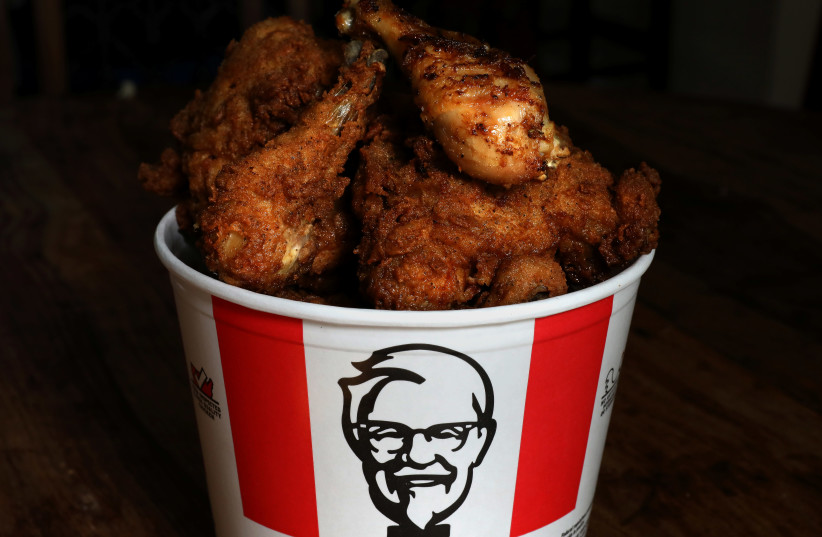 A Kentucky Fried Chicken (KFC) bucket of mixed fried and grilled chicken is seen in this picture illustration taken April 6, 2017 (photo credit: REUTERS/CARLO ALLEGRI)