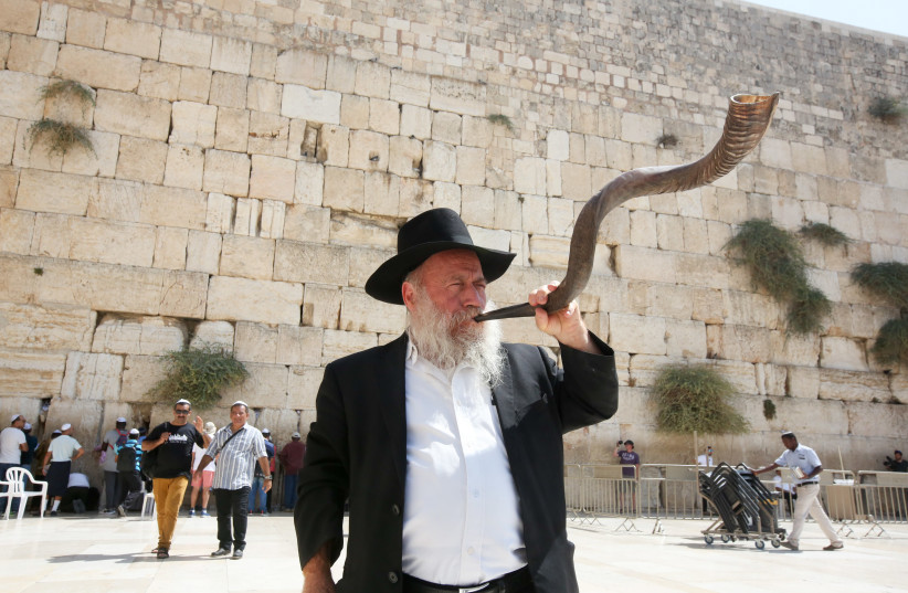 Man with shofar at Western Wall, September 4, 2018 (photo credit: MARC ISRAEL SELLEM)