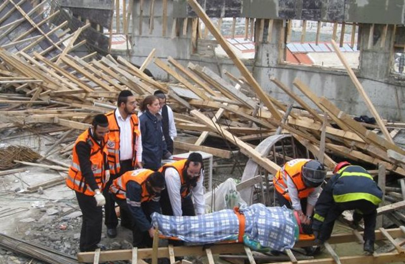 United Hatzalah volunteers working to save lives after a building collapsed. (photo credit: COURTESY UNITED HATZALAH)