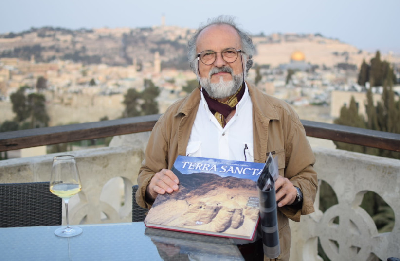 Photographer Enrico Formica presents his new book "Terra Sancta", published in honor of the 130th anniversary of the Notre Dame piligrim center in Jerusalem September 13, 2018 (photo credit: JULIANE HELMHOLD)