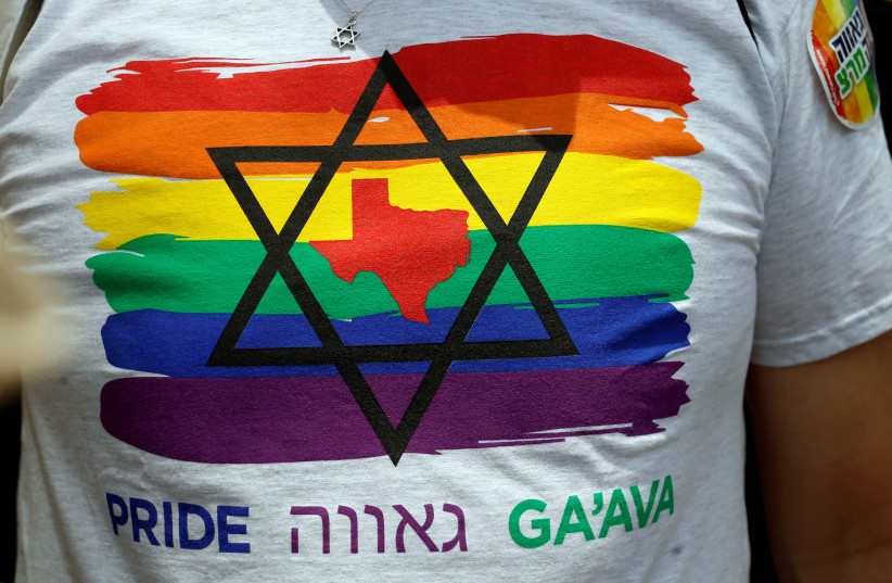 A Texan American Jewish man takes part in a gay pride parade in Tel Aviv, Israel, June 3, 2016.  (photo credit: BAZ RATNER/REUTERS)