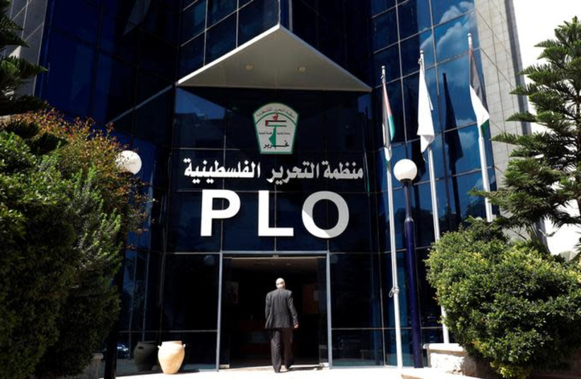 A man enters the headquarters of the Palestinian Liberation Organization (PLO), in Ramallah September 10, 2018 (photo credit: MOHAMAD TOROKMAN/REUTERS)