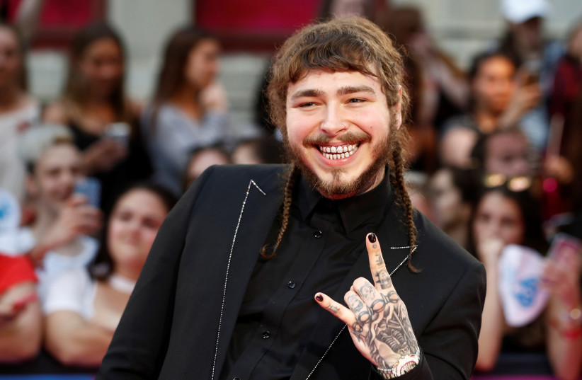 Rapper Post Malone arrives at the iHeartRadio MuchMusic Video Awards (MMVA) in Toronto, Ontario, Canada, June 18, 2017 (photo credit: MARK BLINCH/ REUTERS)