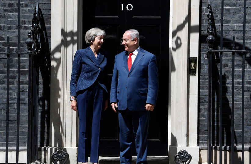 Britain's Prime Minister Theresa May welcomes Israel's Prime Minister Benjamin Netanyahu to Downing Street in London, June 6, 2018 (photo credit: REUTERS/TOBY MELVILLE)