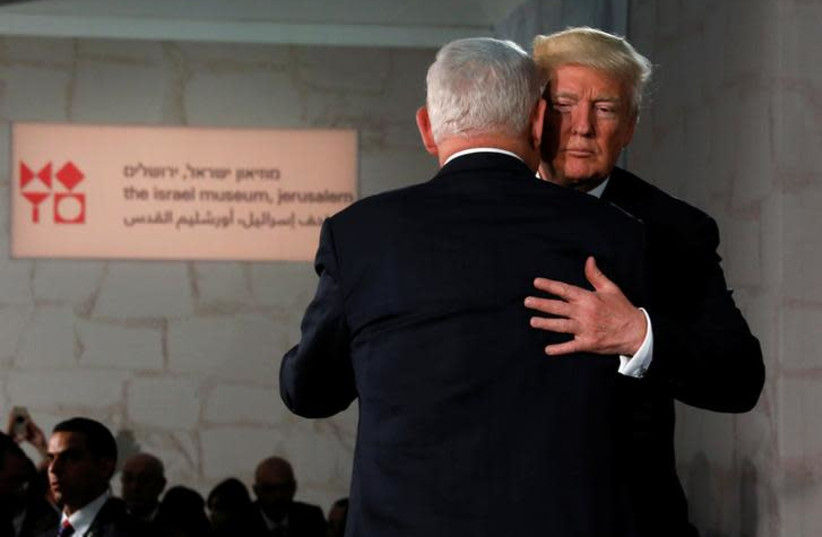 U.S. President Donald Trump (R) embraces Israel's Prime Minister Benjamin Netanyahu after his remarks at the Israel Museum in Jerusalem May 23, 2017 (photo credit: JONATHAN ERNST / REUTERS)