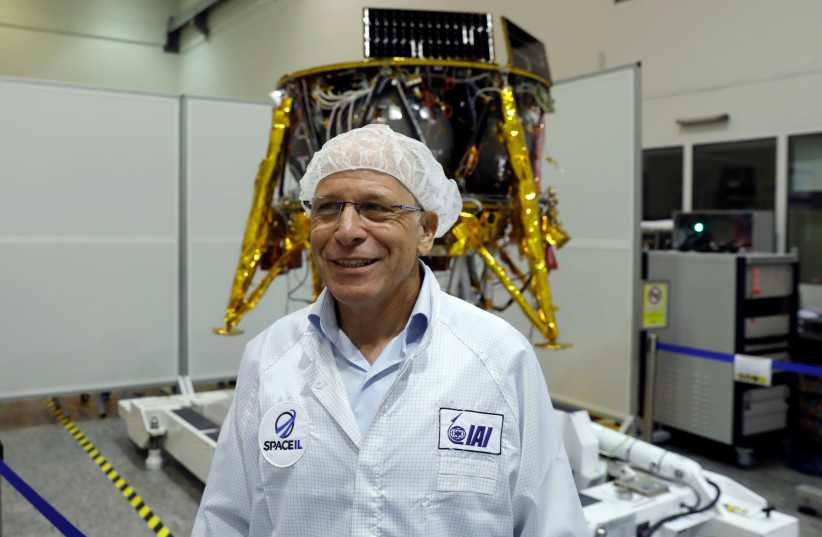 Ido Anteby, SpaceIL's CEO stands in front of an unmanned spacecraft which an Israeli team plans to launch into space at the end of the year and to land it on the Moon next year, in Yahud, Israel. (photo credit: RONEN ZVULUN/REUTERS)