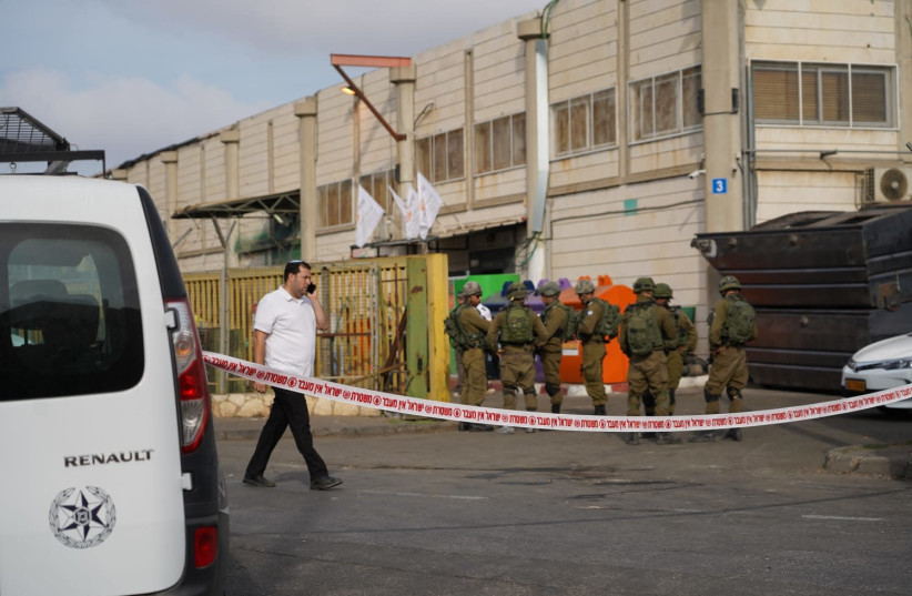 IDF and Magen David Adom at the sceneof the terror shooting in the Barkan industrial Zone (photo credit: HALLEL MEIR/TPS)