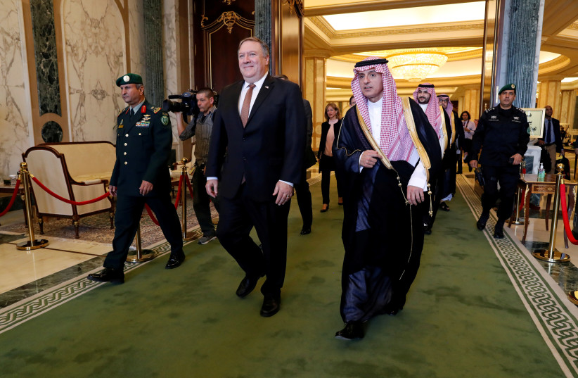 U.S. Secretary of State Mike Pompeo walks with Saudi Foreign Minister Adel al-Jubeir in Riyadh, Saudi Arabia, October 16, 2018 (photo credit: LEAH MILLIS/REUTERS)