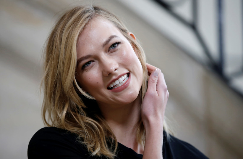 Model Karlie Kloss poses during a photocall before the French fashion house Christian Dior Fall/Winter 2017-2018 women's ready-to-wear collection during Fashion Week in Paris, France March 3, 2017 (photo credit: REUTERS/GONZALO FUENTES)