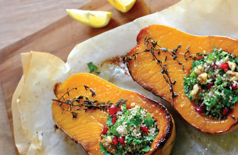 BUTTERNUT SQUASH FILLED WITH COUSCOUS, HERBS AND POMEGRANATE SAUCE (photo credit: PASCALE PEREZ-RUBIN)