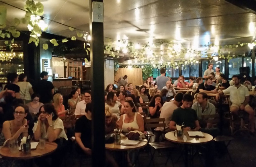 Immigrants hear Tel Aviv mayoral candidates at the city's Kanta bar (photo credit: JAY ROSEN)