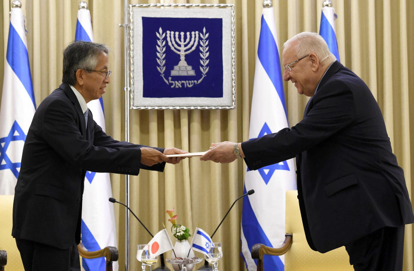 President Reuven Rivlin accepts a letter of credence from the Japanese ambassador (photo credit: Mark Neiman/GPO)