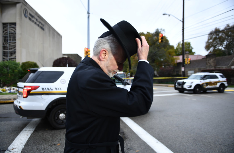 Rabbi Jeffrey Myers of the Tree of Life synagogue walks after speaking to reporters on October 29, 2018  (photo credit: BRENDAN SMIALOWSKI / AFP)