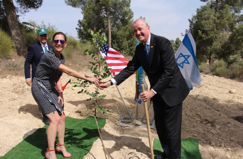 New Jersey Governor Phil Murphy and his wife Tammy with their newly planted tree in Yad Kennedy (photo credit: KKL-JNF)