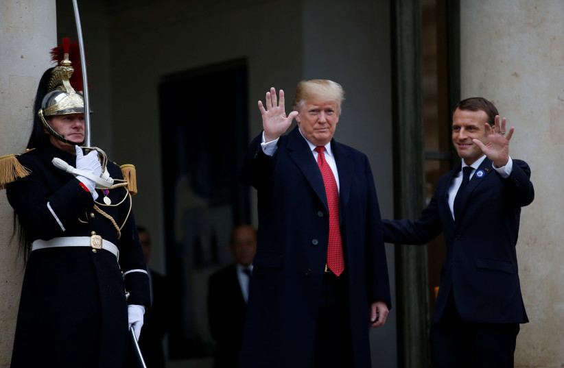 French President Emmanuel Macron welcomes U.S. President Donald Trump at the Elysee Palace on the eve of the commemoration ceremony for Armistice Day, 100 years after the end of the First World War, in Paris, France, November 10, 2018. (photo credit: VINCENT KESSLER/ REUTERS)