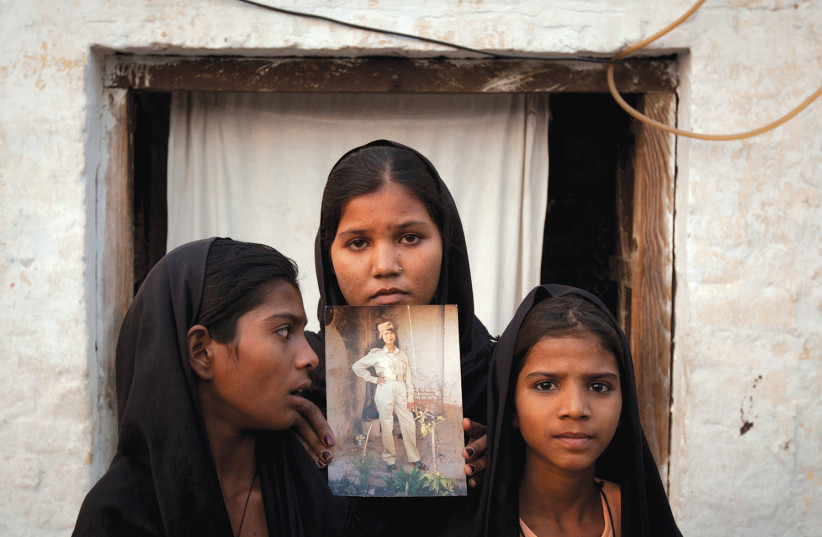 THE DAUGHTERS of Asia Bibi, a Christian woman who has been persecuted by Pakistan’s extremist far-right religious Islamic laws in a country dominated by mobs that preach hate (photo credit: REUTERS)