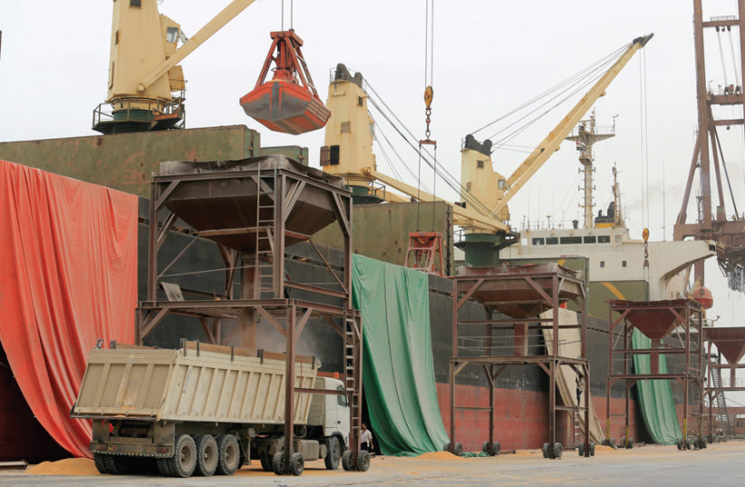 UNLOADING A grain shipment at the Red Sea port of Hodeidah, Yemen, on August 5. (photo credit: REUTERS)
