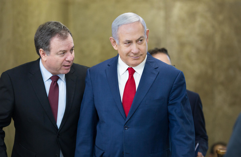 Prime Minister Benjamin Netanyahu arrives at a weekly cabinet meeting, November 18, 2018 (photo credit: EMIL SALMAN/POOL)